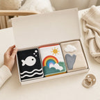 Newborn 3-Book Stage Gift Box size comparison with baby hands