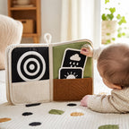Visual Flash Card + Cloth Book Hybrid in use — baby playing with cloth book