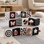 Accordion Tummy Time Long Roll Book in use — baby playing with cloth book