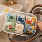 Large Bath Cloth Book 6-Piece Set with Mesh Bag in use — baby playing with cloth book
