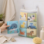 Large Bath Cloth Book 6-Piece Set with Mesh Bag size comparison with baby hands