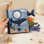 Ocean Tails Touch & Mirror Cloth Book size comparison with baby hands
