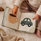 My First Bilingual Everyday Words Cloth Book in use — baby playing with cloth book