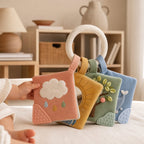 Anti-Loss Storage Ring Mini Book Set in use — baby playing with cloth book