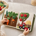 Farm Harvest Sorting Quiet Book in use — baby playing with cloth book
