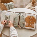 Contextual Life Skills Cloth Book in use — baby playing with cloth book