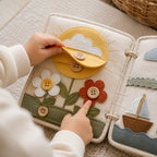 Reinforced Button Busy Book in use — baby playing with cloth book