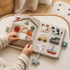 Everyday Words Multilingual Cloth Book in use — baby playing with cloth book