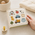 Everyday Words Multilingual Cloth Book size comparison with baby hands